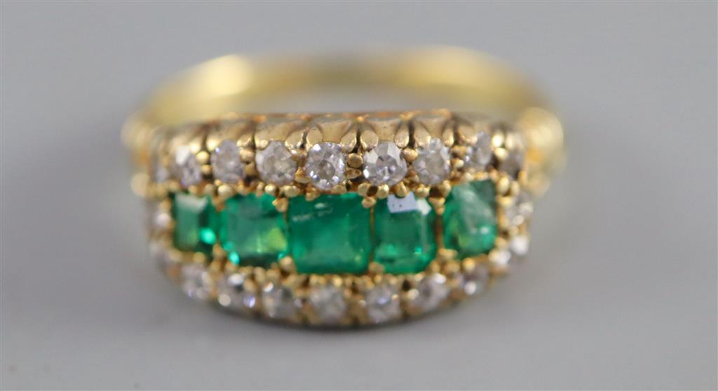 A late Victorian gold, graduated five stone emerald and diamond cluster half hoop ring,